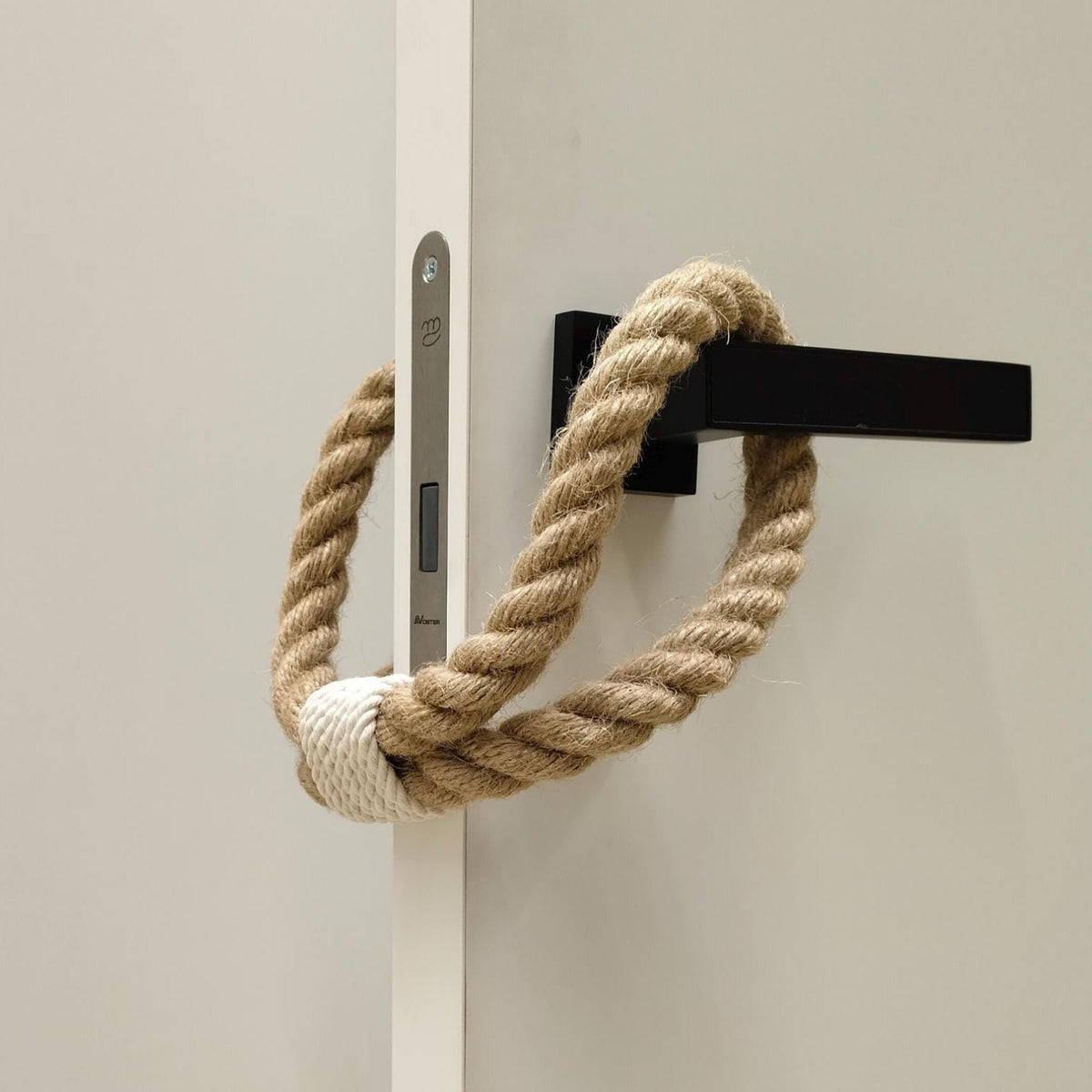 Rope door handle on a light-colored door